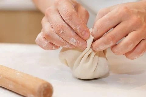 Khinkali Dumpling Preparation by Hand During Traditional Georgian Home Cookin Stock Photos