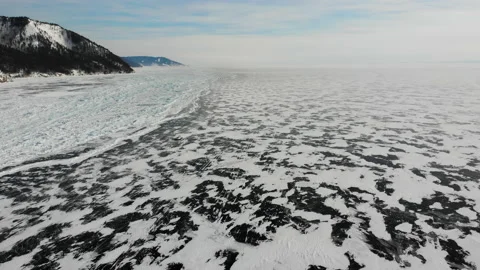 Khivus or hovercraft rides on the ice of frozen Lake Baika Stock Footage 200438545