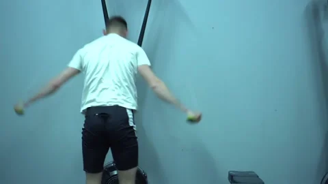 KHMELNYTSKYI, UKRAINE - MAY 9, 2020: Man exercising on row machine in gym. Stock Footage 132724057