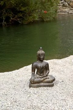 Khmer buddha in front of the river Stock Photos