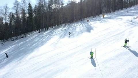 Ki instructors prepare a slalom course on a groomed ski slope Stock-Footage 285900588