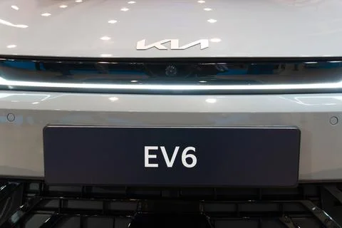 Kia EV6 front logo and model plate with light bar close-up at ECAR Show 2026 Stock Photos