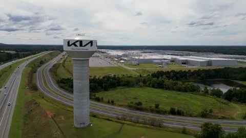 Kia West Point Assembly Plant water tower beside Interstate 85 in West Point Stock Footage 331575903