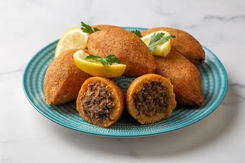 Kibbeh is a popular dish in Middle Eastern cuisine (Turkish name; icli kofte) Stock Photos