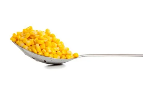 Kichen spoon with yellow corn Stock Photos
