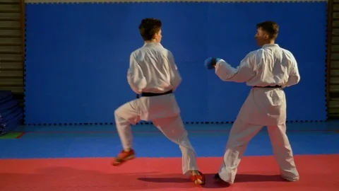 Kick box combat between two practitioners at the gym Stock Footage 76396173