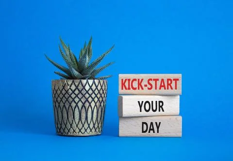 Kick-start your day team symbol. Wooden blocks with words Kick-start your d.. Fotos de archivo