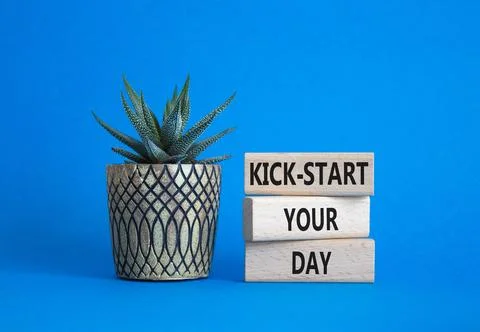 Kick-start your day team symbol. Wooden blocks with words Kick-start your d.. Fotos de archivo