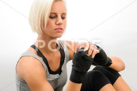 Kickbox woman put on protective gloves fitness Stock Photos