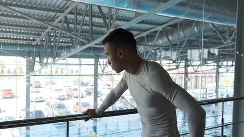 Kickboxer athlete is resting after a workout in the gym with mirrors. Stock Footage 114293353