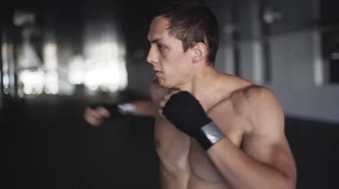 Kickboxer boxing as exercise for the fight. 4K Stock Footage 64055948