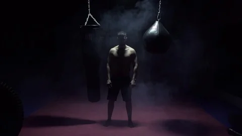 Kickboxer shadow boxing as exercise for the big fight Stock Footage 80861869