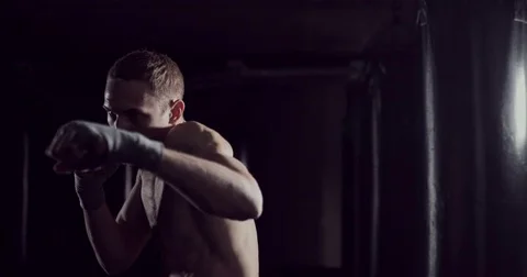 Kickboxer shadow boxing as exercise for ... | Stock Video | Pond5