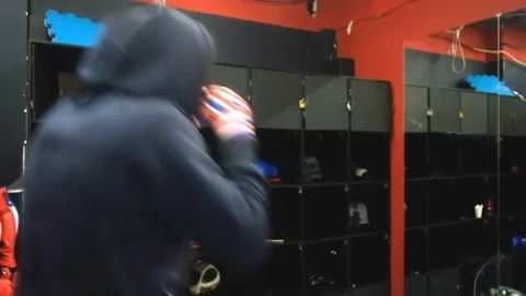 Kickboxer is training in the gym. half-length profile view. Thai boxing 動画素材 127026693