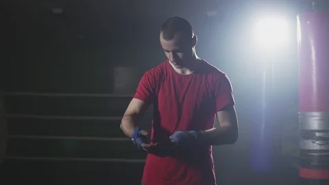 Kickboxer wapping hands getting ready for fight in slow motion 스톡 동영상 110436118