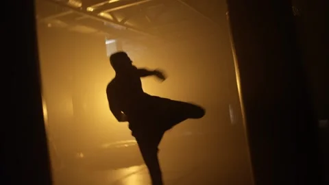 Kickboxing, man fighter training his punches, beating a punching bag training Stock Footage 204846986