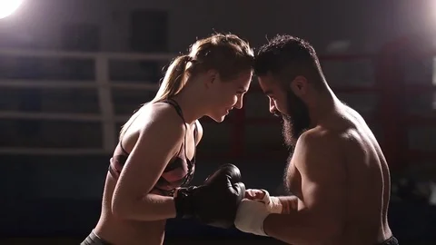 Kickboxing training in the ring. The trainer with the apprentice conduct Stock Footage 76529113