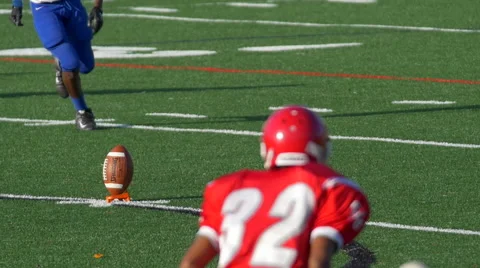A kicker gets ready to kick off while playing American football. Stock Footage 68017349