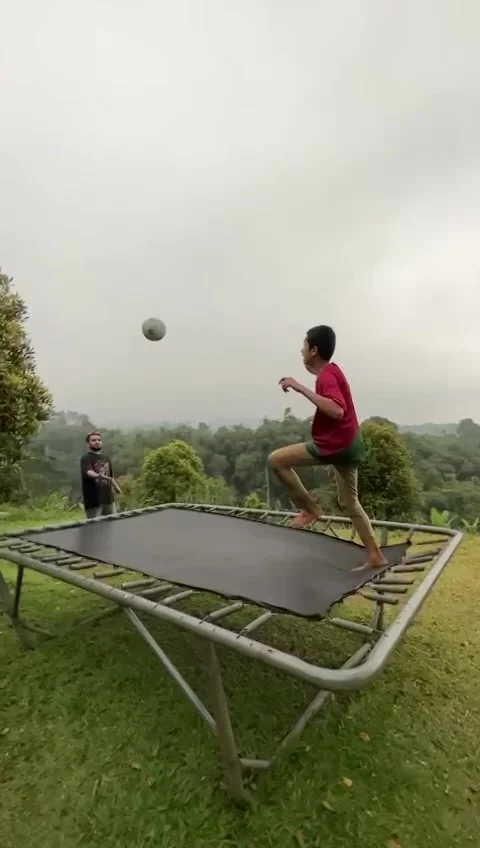 Kicking and Jumping on a Trampoline 動画素材 244139286