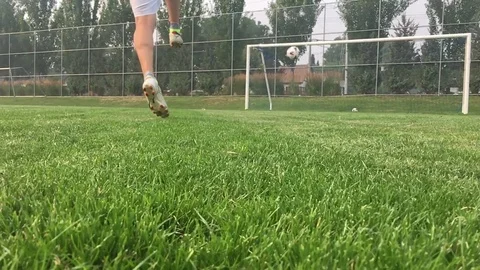 Kicking a Ball in slow motion Stock Footage 79698368