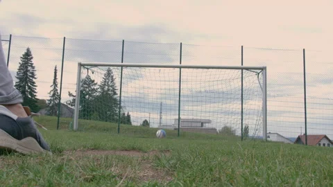 Kicking a ball towards an empty goal Stock Footage 153378151