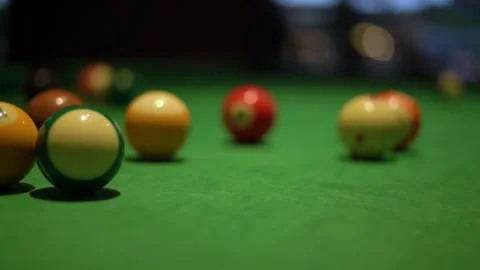 Kicking of balls with pool stick on table with green fabric Stock Footage 152075534