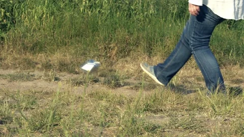 Kicking the can down the road metaphor concept Stock Footage 244241341