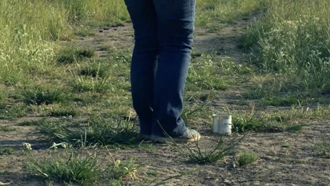 Kicking the can down the road metaphor concept Stock Footage 245375049