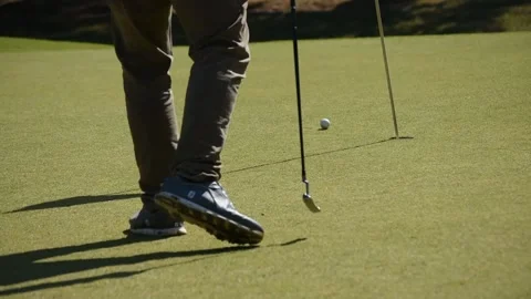 Kicking a golf ball on the course Stock Footage 146466455