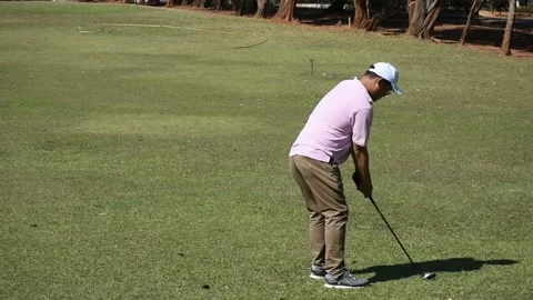 Kicking a golf ball on the course Stock Footage 146468386
