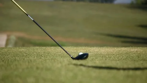 Kicking a golf ball on the course Stock Footage 146487032