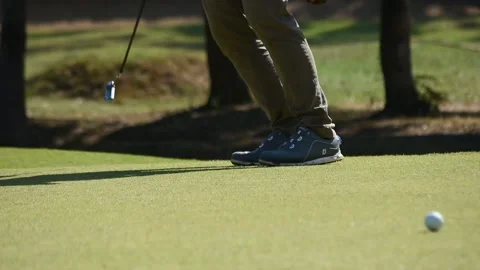 Kicking a golf ball on the course Stock Footage 146487039
