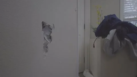 Kicking Hole in Wall Construction. Wall Impact: Intense Footage. Stock Footage 145430106