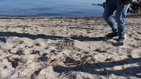 Kicking sand particles slow motion Video stock 153563782