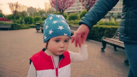 Kid 2 years old, walking with mom in the park. Stock Footage 153559916