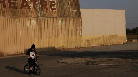 Kid at abandoned theatre Stock Footage 101944811