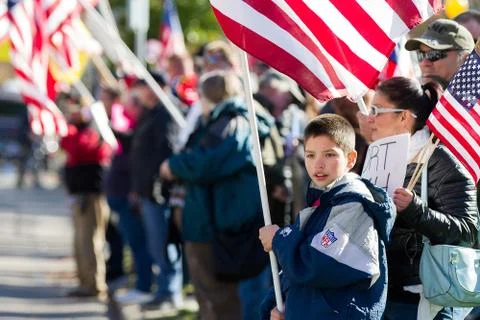 Kid with an american flag Stock Photos