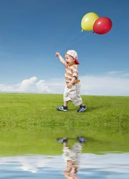 Kid and balloon Stock Photos