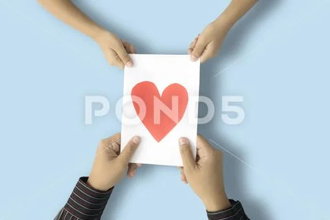 Kid and father holding greeting card Stock Photos