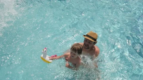 Kid and father pool child swimming girl kid and parent child dad pool kid Stock Footage 194819315