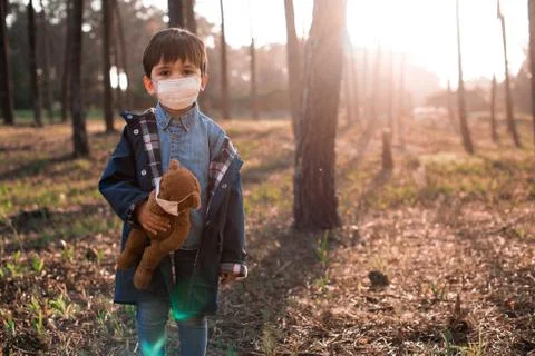 Kid and teddy bear using air masks Stock Photos