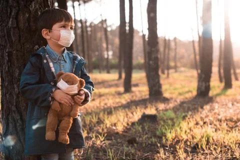Kid and teddy bear using air masks Stock Photos