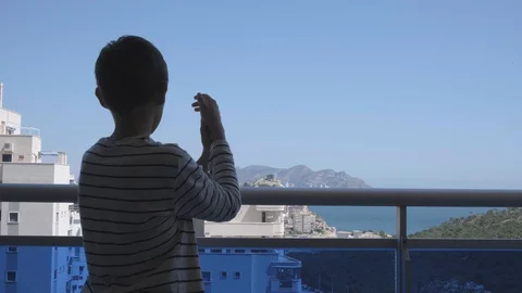 Kid applauding in support of medics during the Coronavirus pandemic Stock Footage 128030114