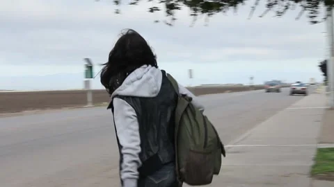Kid with backpack crossing street Stock Footage 155388454