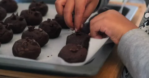 Kid baking chocolate cookies Stock Footage
