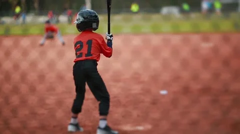 Kid Batting and Running at Baseball Game Stock Footage 47709260