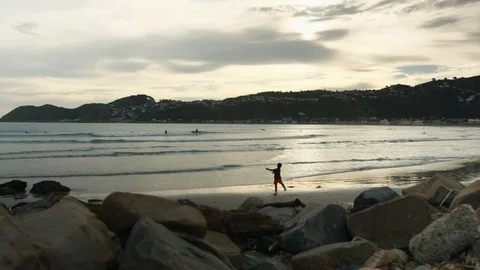 Kid on Beach in the Evening Stock Footage 86675055