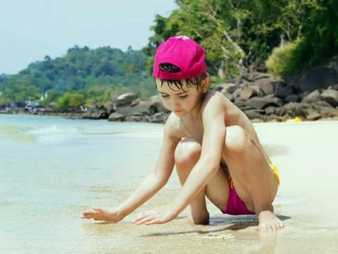 Kid on the beach Stock Photos