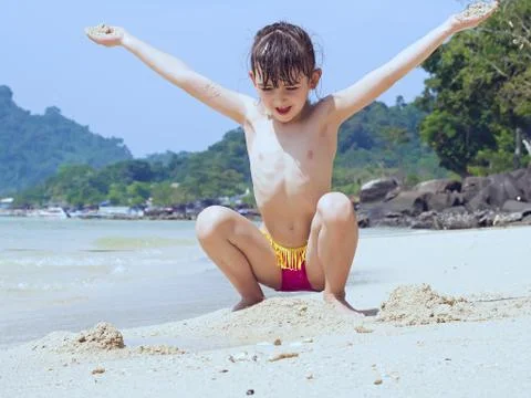 Kid on the beach Stock Photos
