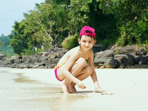 Kid on the beach Stock Photos